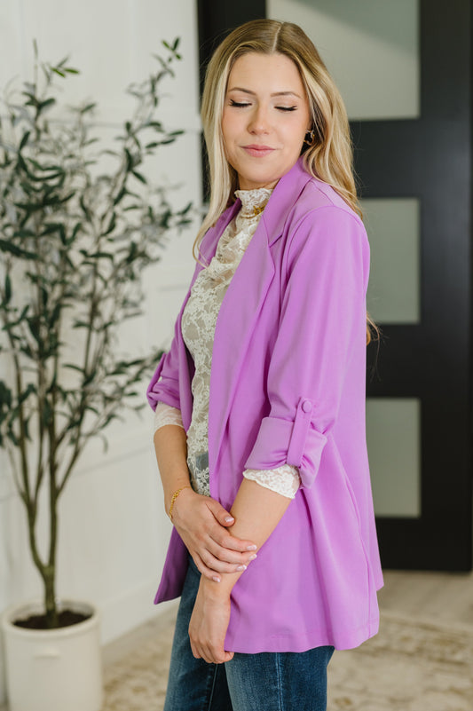 Side view of Remi Orchid Glow Blazer showing tailored fit, open front, and 3/4 sleeves with stylish sleeve tabs.