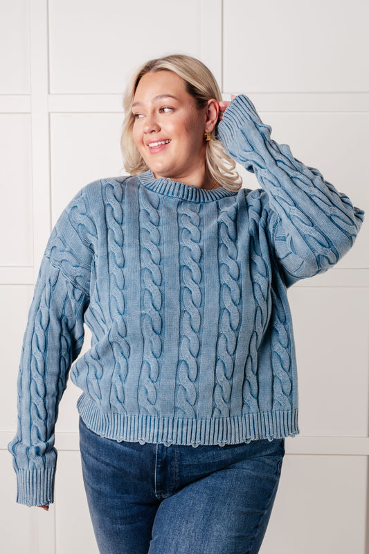 Plus size model wearing the Drea Cable Knit Sweater in mineral washed blue with dropped shoulders.