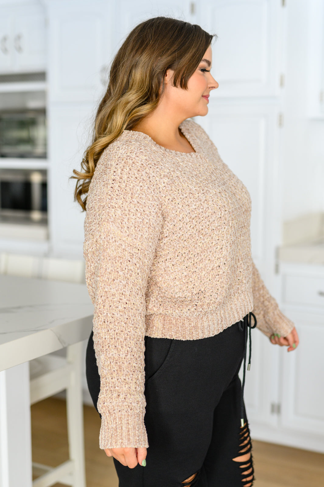 Plus size model side view of Irene Chenille Crop Sweater in coffee with long sleeves and loose fit.