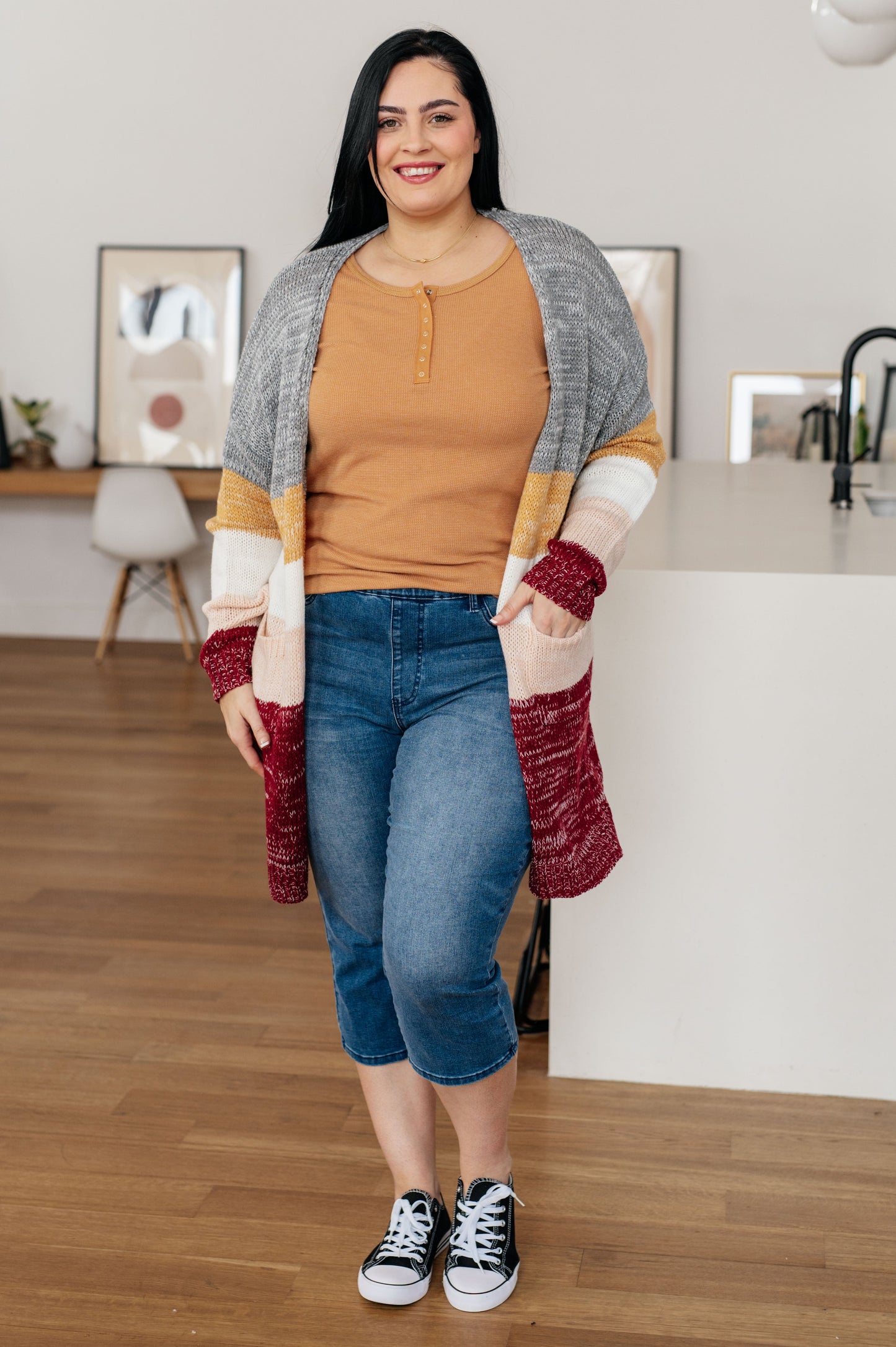 Plus size full body view of Clara Long Henley in golden sand waffle knit styled with jeans.