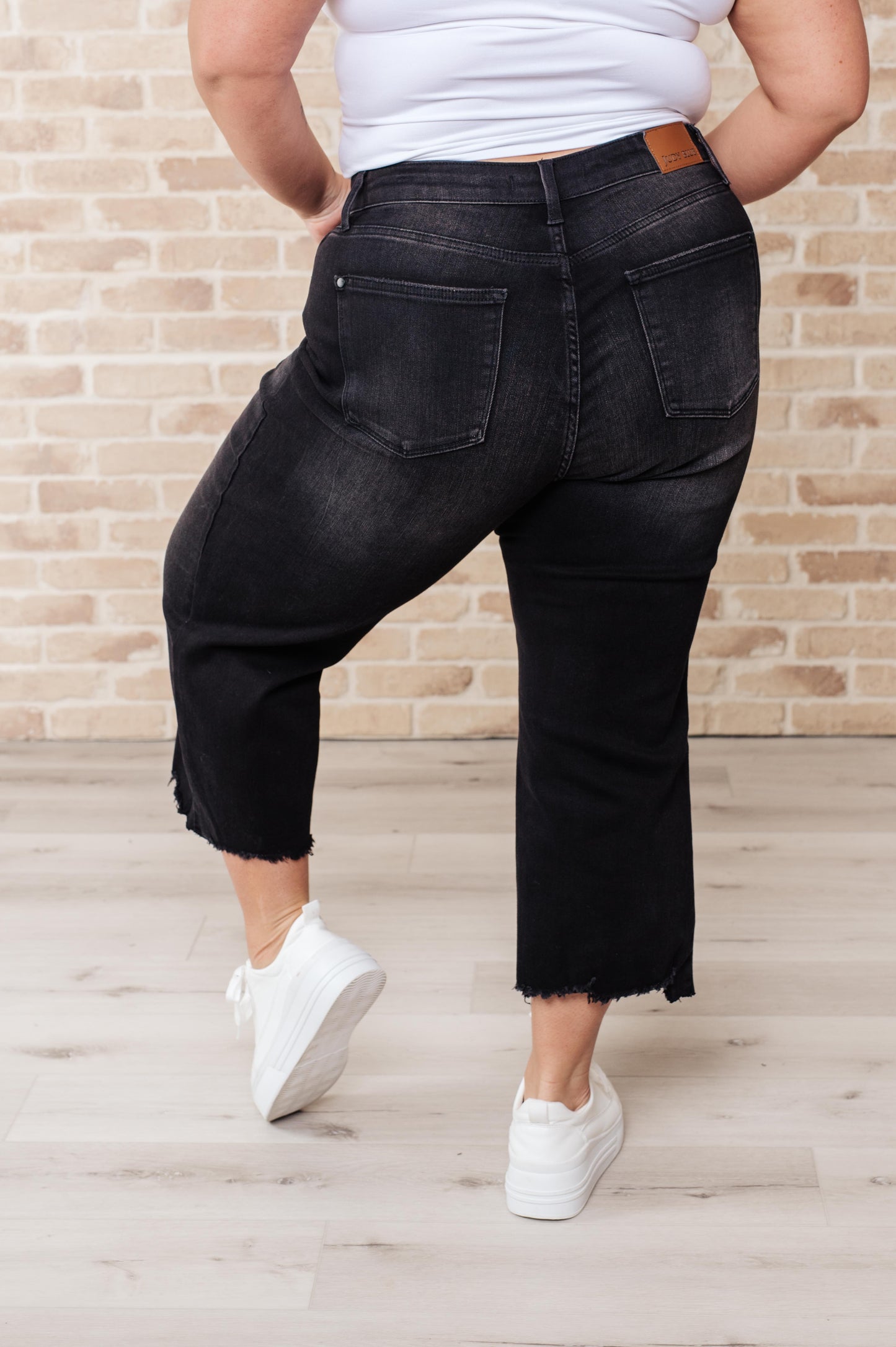 Plus size back view of Ryan High Rise Wide Leg Crop Jeans showing flattering high rise and cropped hem.