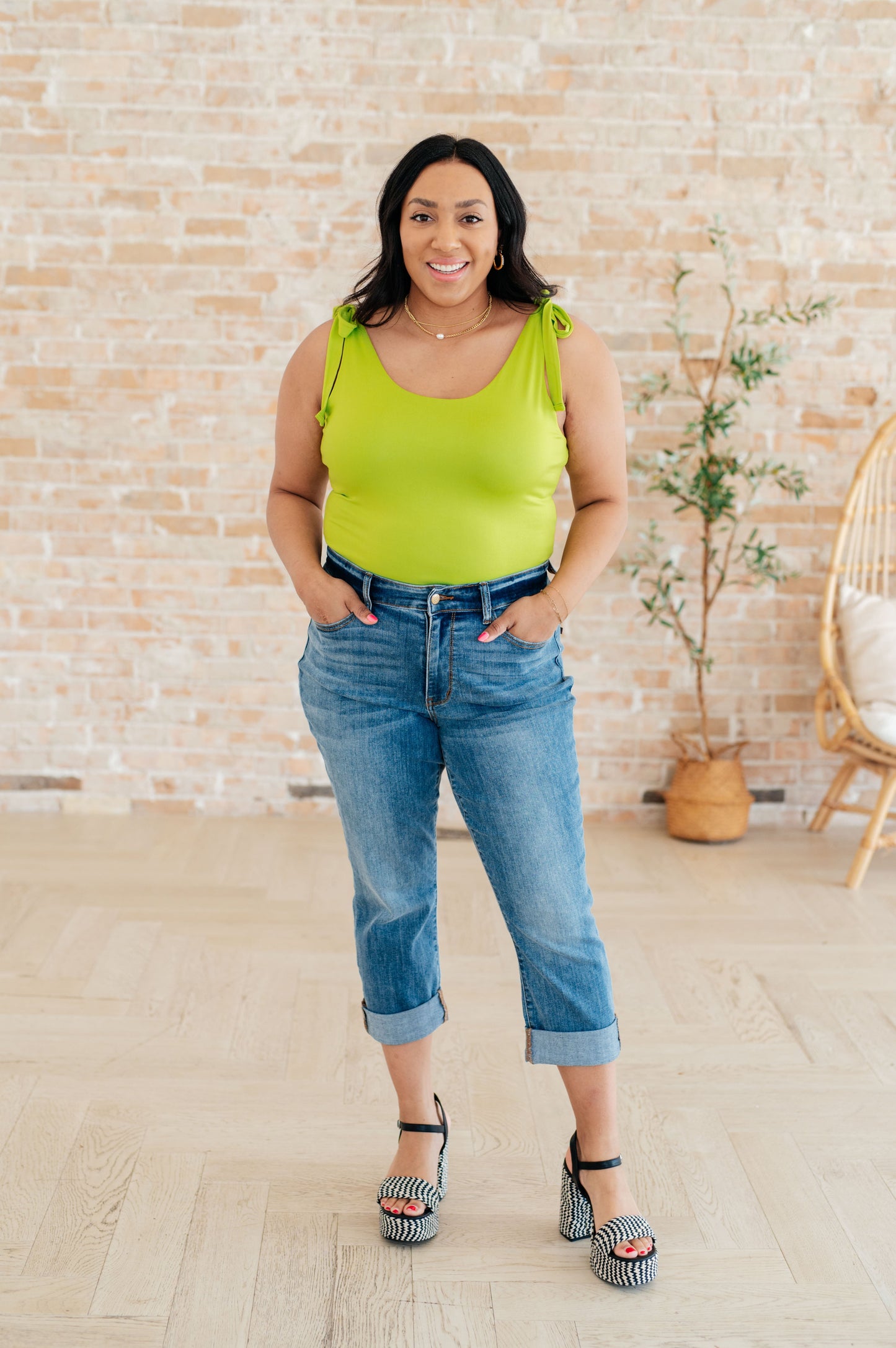 Plus size full body view of Juska Bodysuit in lime green, showcasing scoop neckline, adjustable straps, and body-hugging fit.