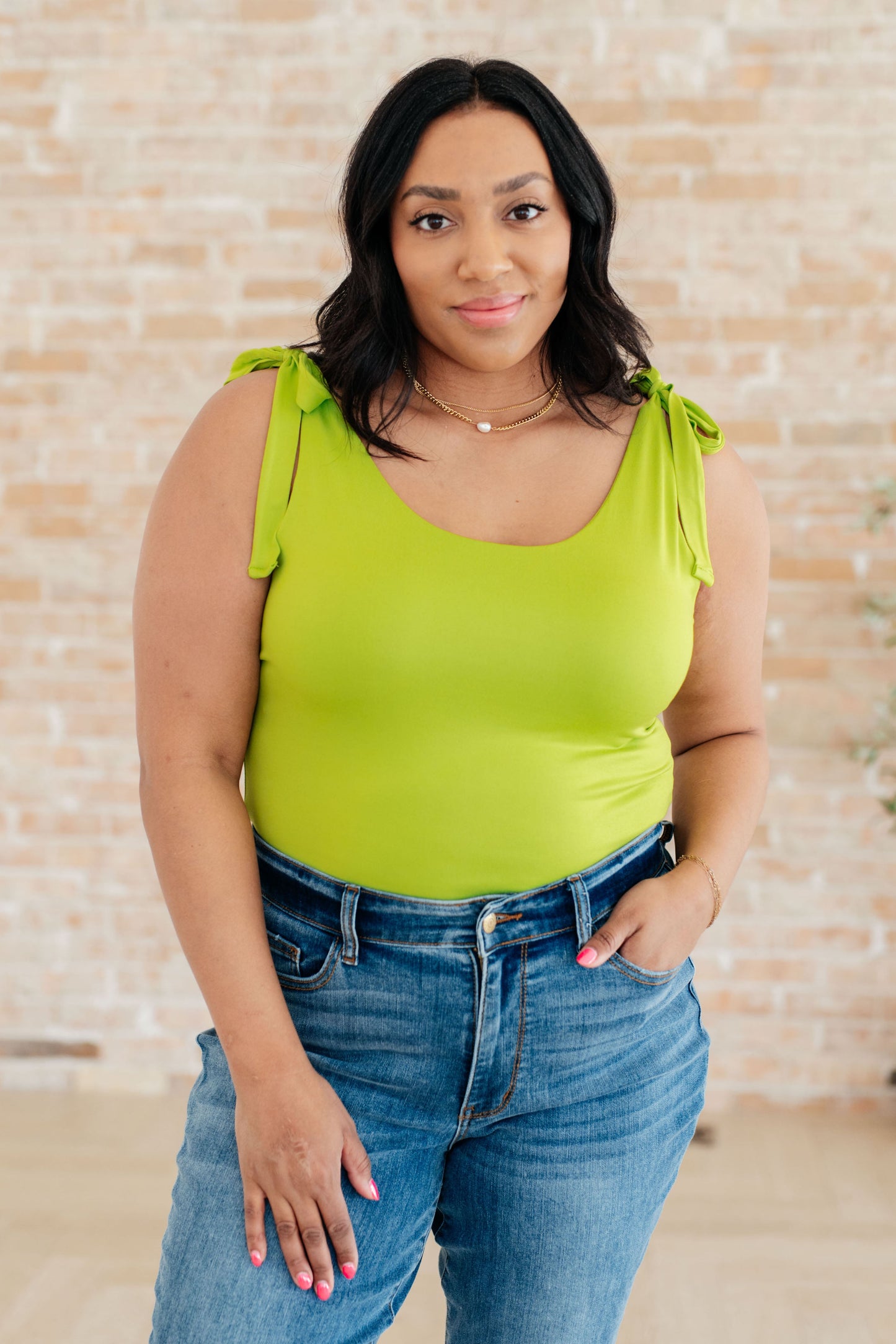 Plus size Juska Bodysuit in lime green featuring scoop neckline, adjustable straps, and secure double lining.