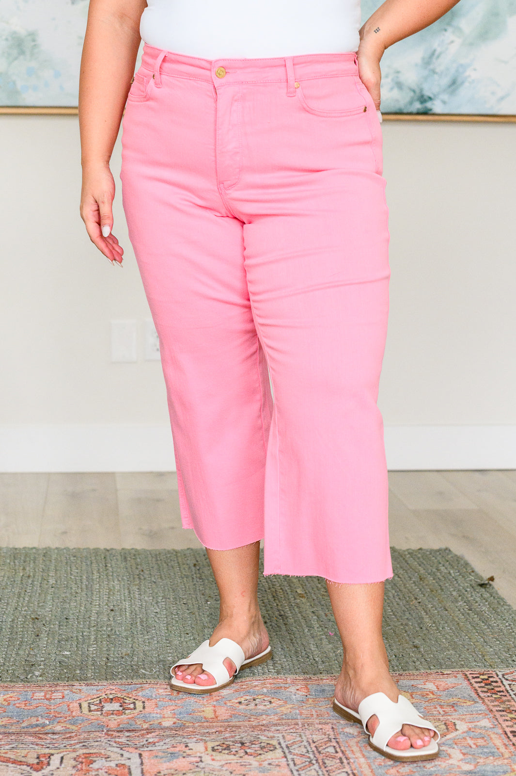 Plus size front view of Lisa High Rise Wide Leg Crop Jeans in pink showing tummy control waist and wide leg crop.