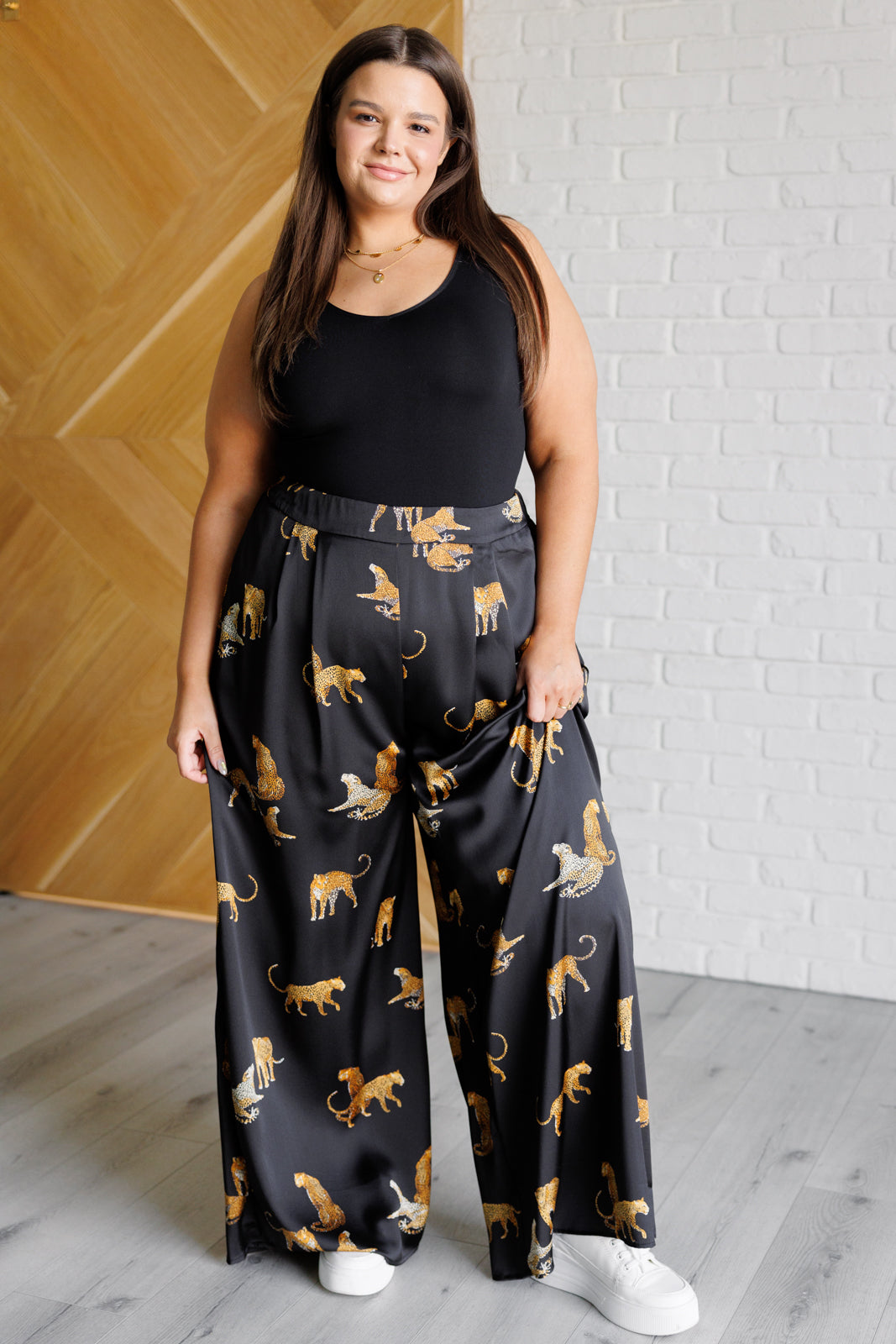 Plus size full body view of Lyra Leopard Satin Wide Leg Pants, bold leopard imagery, high-rise fit, and shiny satin wide-leg style.