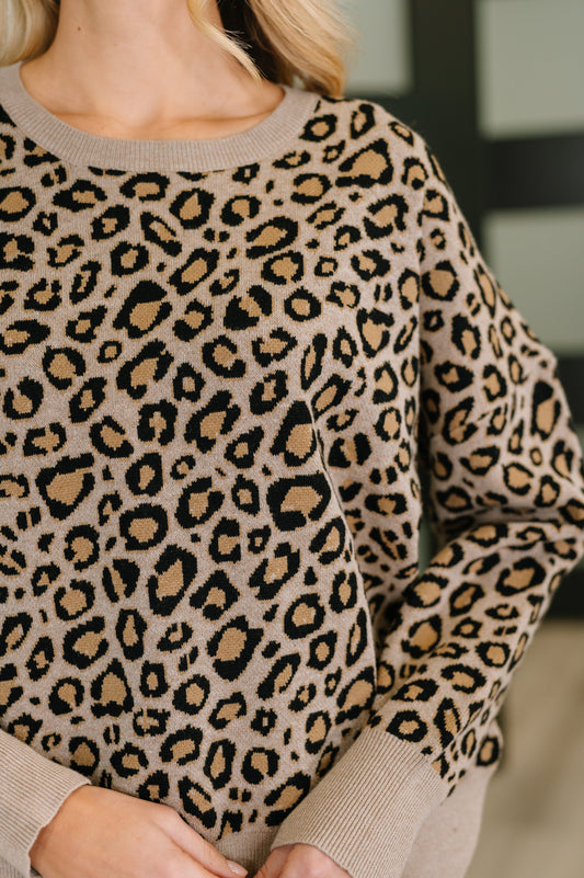 Close-up of Lilith Leopard Print Pullover showing ribbed neckline and beige leopard print.