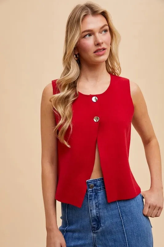 Lonnie cropped red sweater vest with decorative metal buttons and round neckline, perfect for layering.