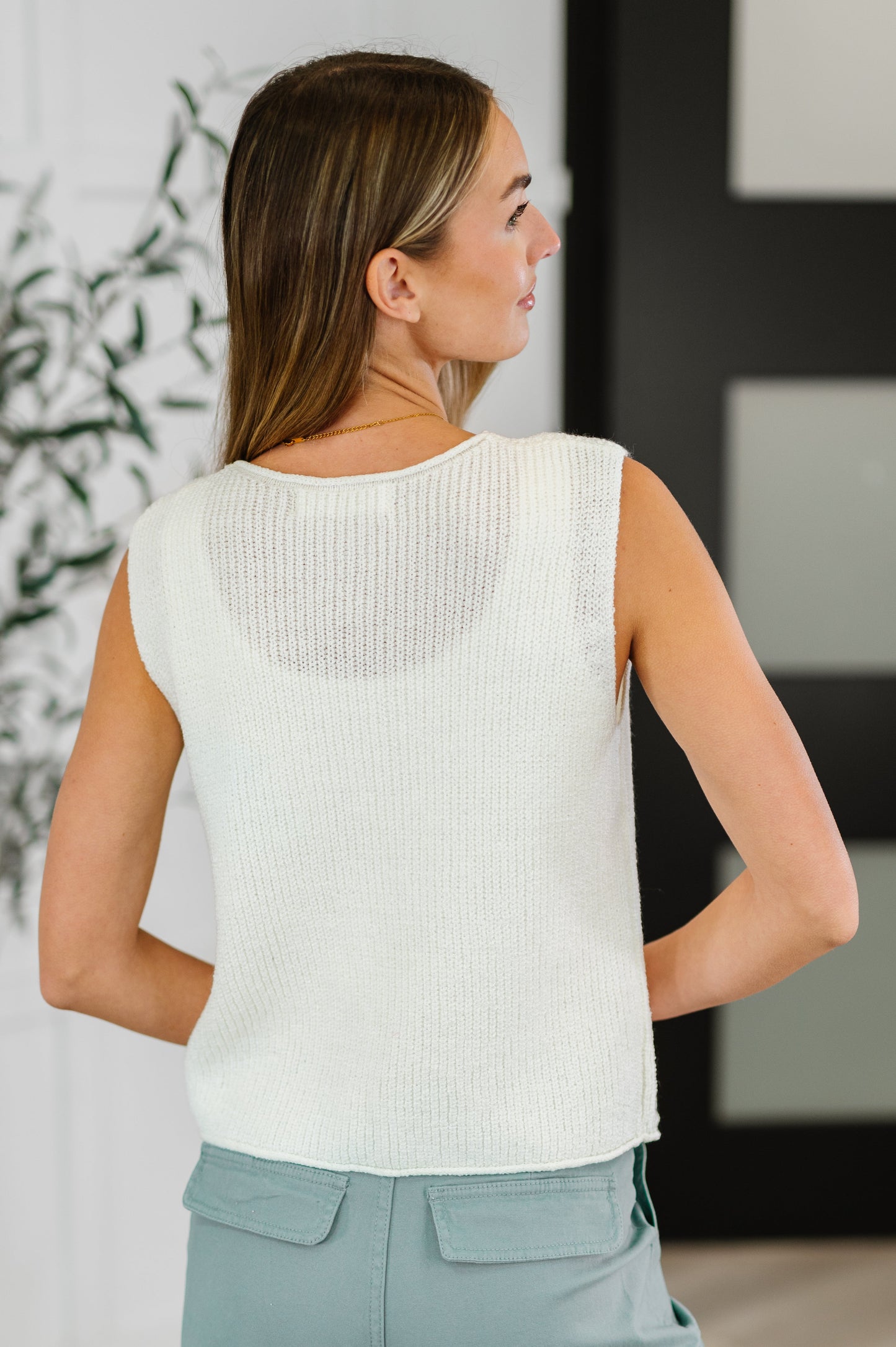 Back view of Lois Tie Front Knit Vest featuring off white knit fabric, sleeveless style, and lightweight fit.