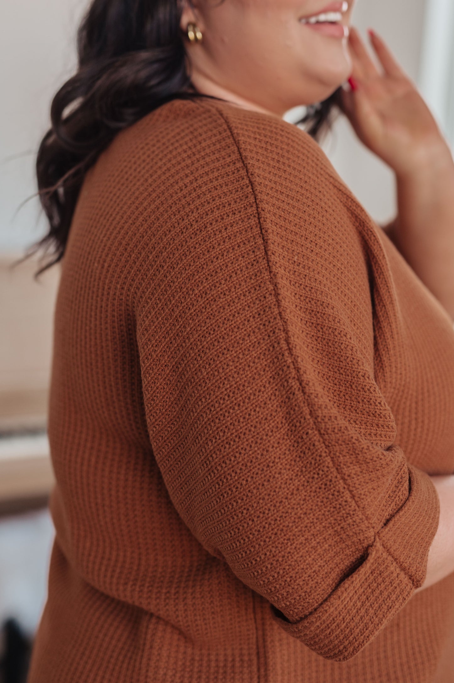 Close-up of Zizi Rust Sweater Top knit texture, showcasing fabric detail and warm rust hue