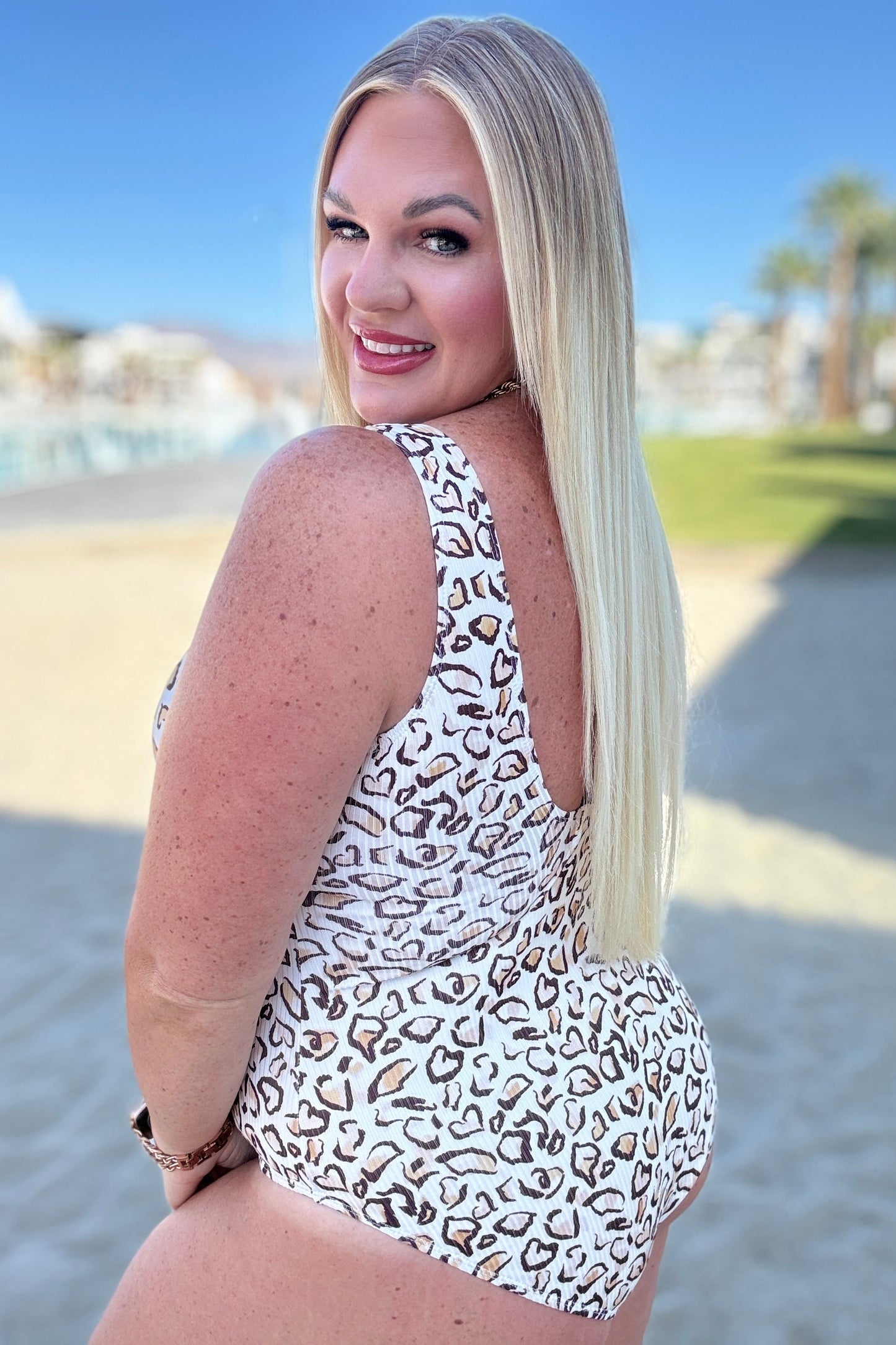 Plus size side view of Madagascar Ribbed Swimsuit, cheetah print with ribbed fabric, notched neckline, and scooped back.