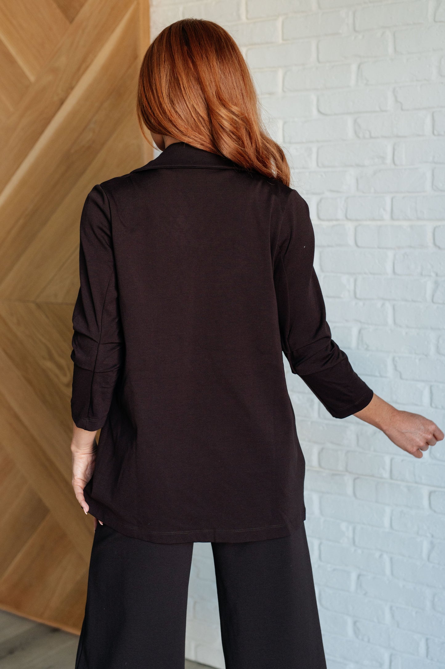 Back view of Devi Magic Blazer in chocolate, showcasing tailored fit and smooth ponte knit fabric.
