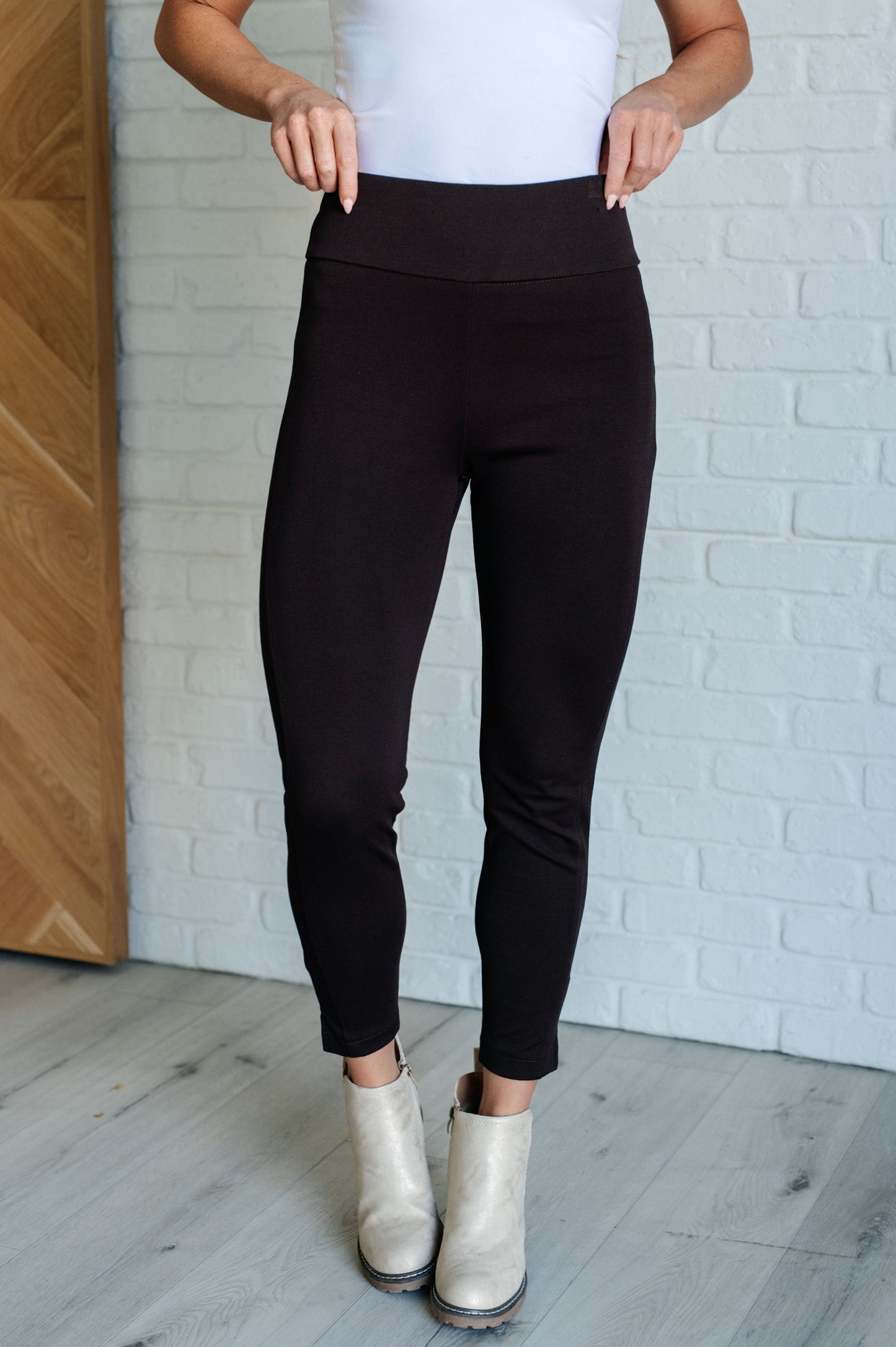 Skinny Pants in Chocolate, high-rise, slim-fit ponte knit fabric with tuxedo stripe, faux welt pockets, and ankle crop. Features elastic waistband and cuff slit.