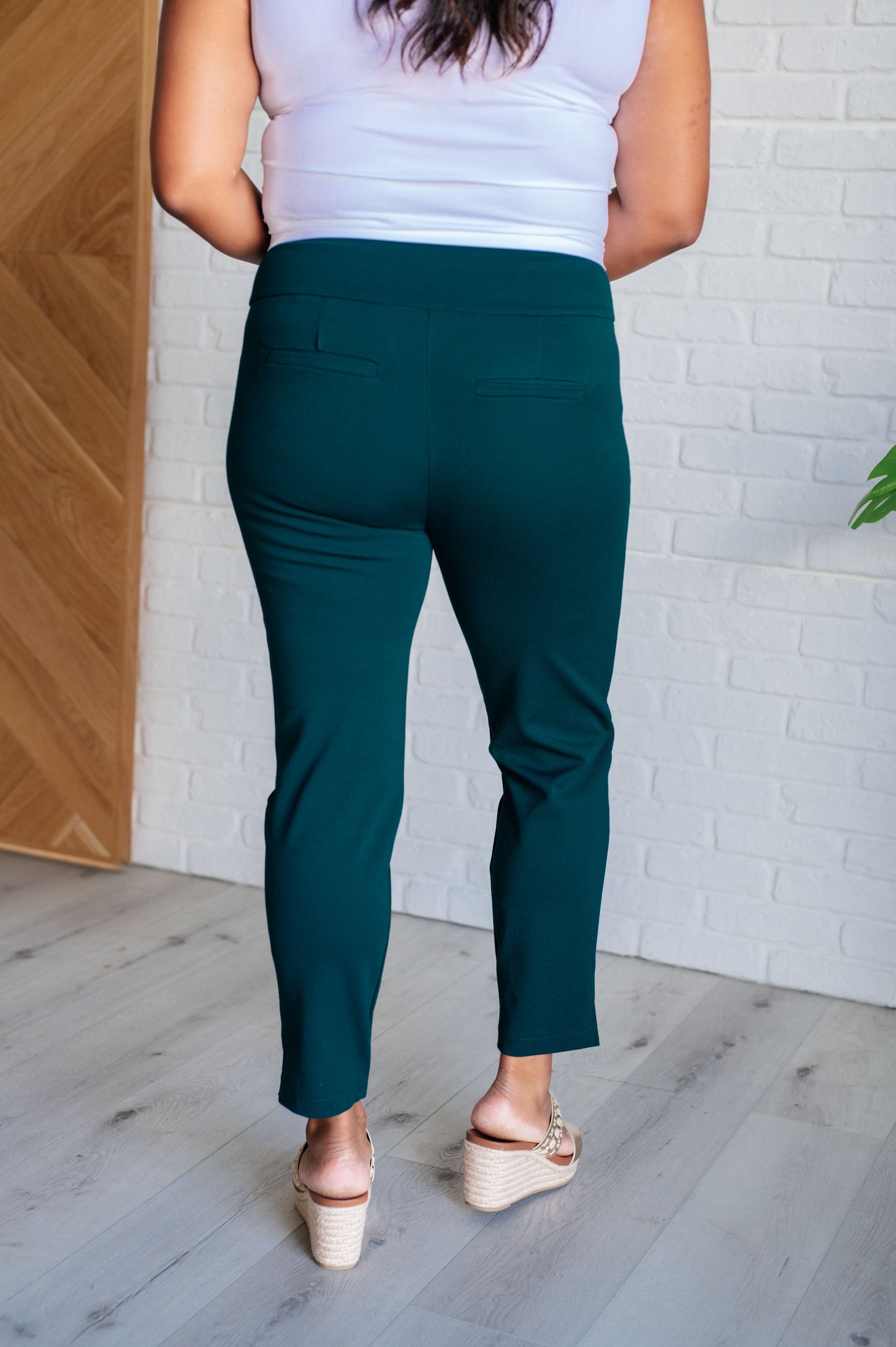 Plus size back view of Hunter Green Midge Magic Skinny Pants with flattering high-rise waist.