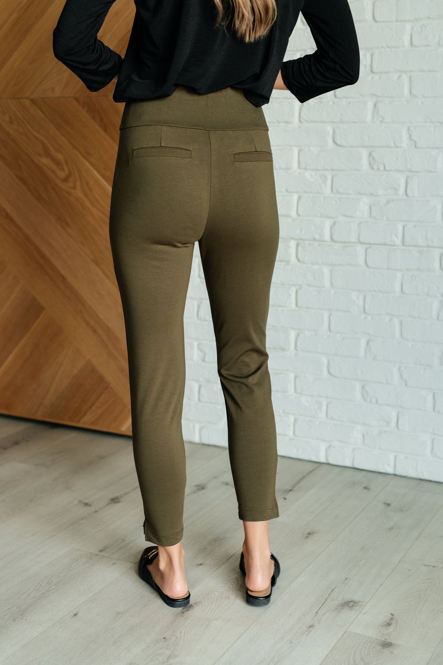 Back view of Midge Magic Skinny Pants in olive with slim fit and faux welt pocket details.