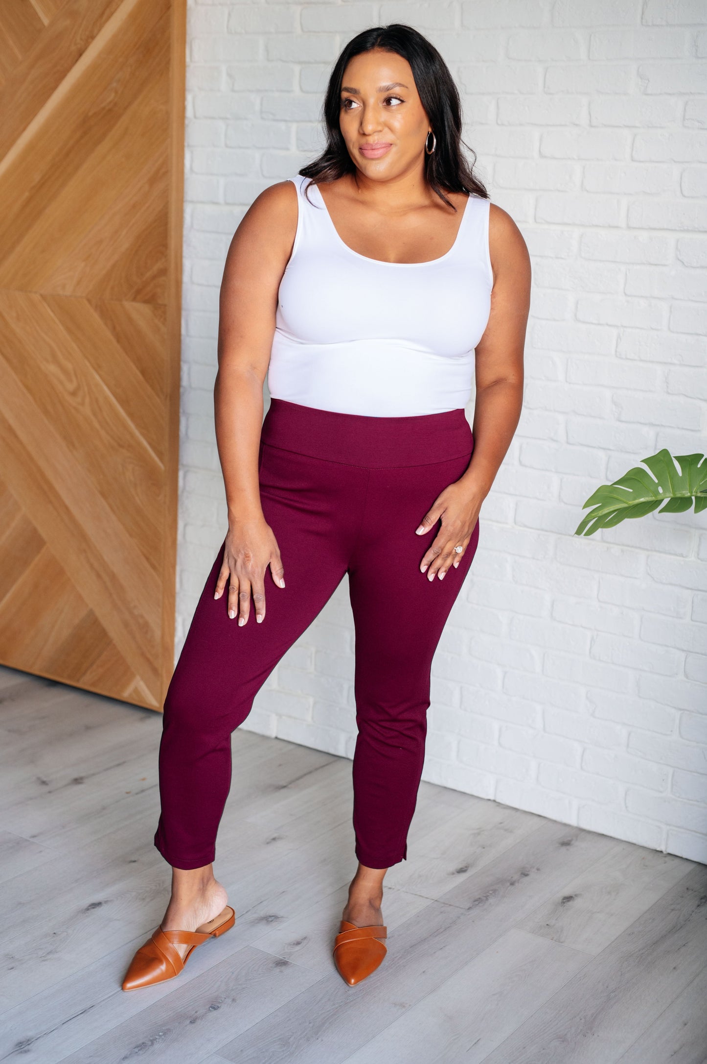 Plus size full body view of Midge Magic Skinny Pants in wine highlighting flattering high rise and faux welt pocket details.