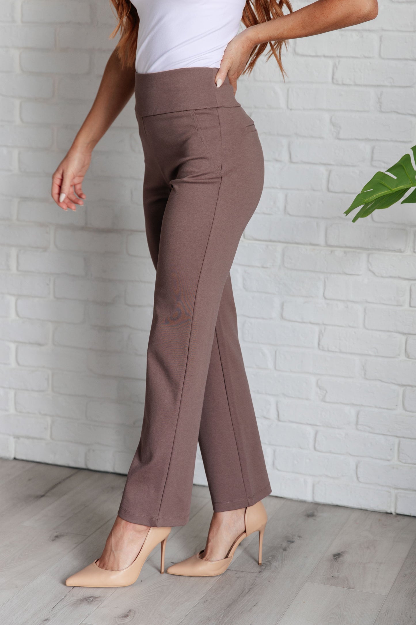 Side angle of Rosita Magic Straight Pants in dark mocha highlighting slim straight leg and vented hem.