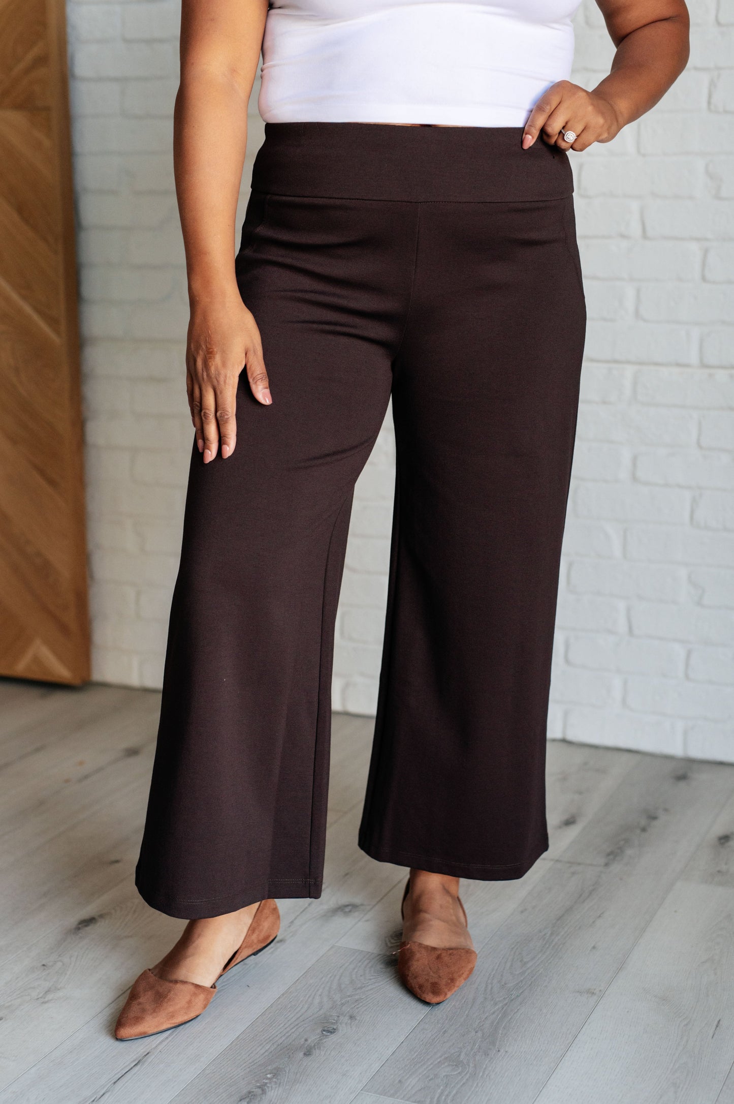 Plus size chocolate ponte knit wide leg crop pants, high-rise fit, cropped hem, and faux welt pocket detail.