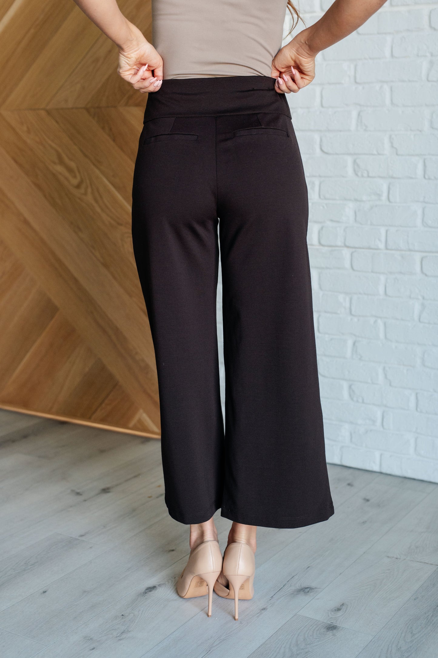 Chocolate ponte knit wide leg crop pants, cropped hem, high-rise waist, faux welt pocket, polished finish.