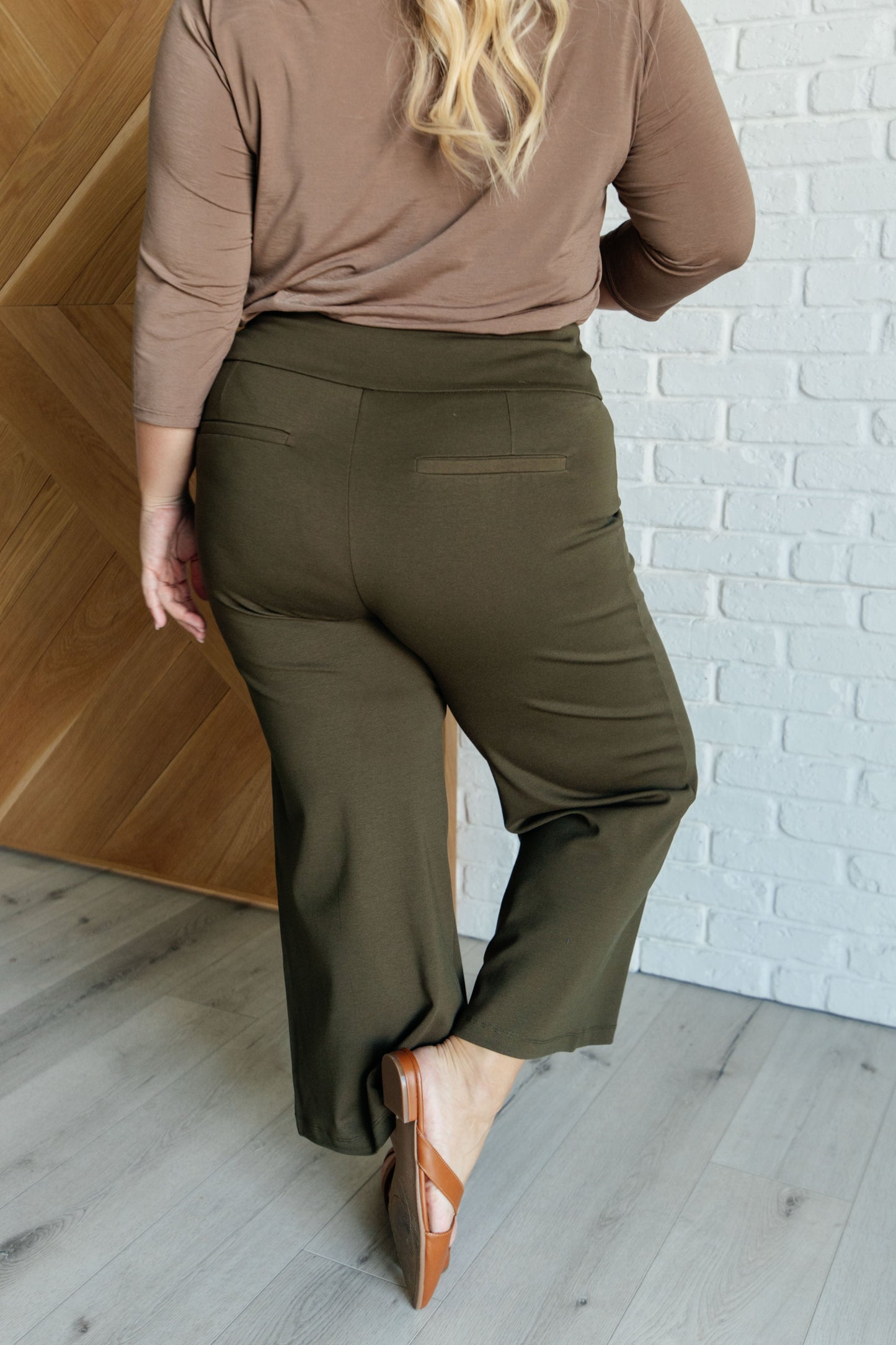 Plus size olive wide leg ponte knit crop pants, cropped hem, high-rise fit, faux welt pocket at back.