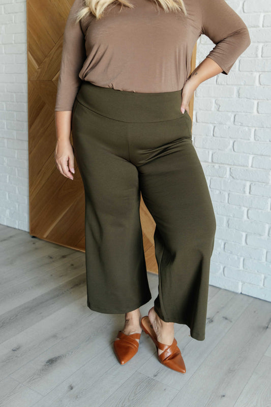 Plus size olive wide leg ponte knit crop pants, high-rise waist, cropped cut, stretchy fit with faux welt pocket.