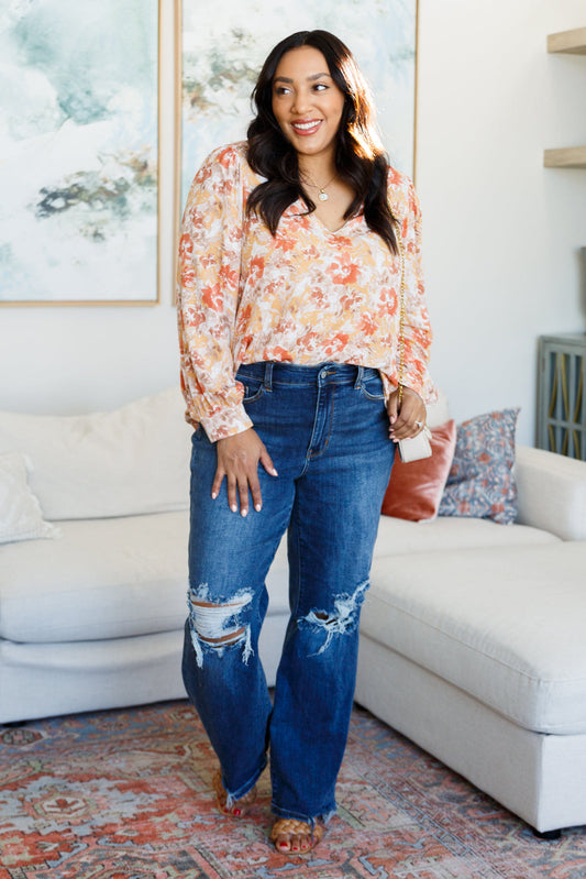 Plus size full body view of Marigold Floral Blouse styled with jeans