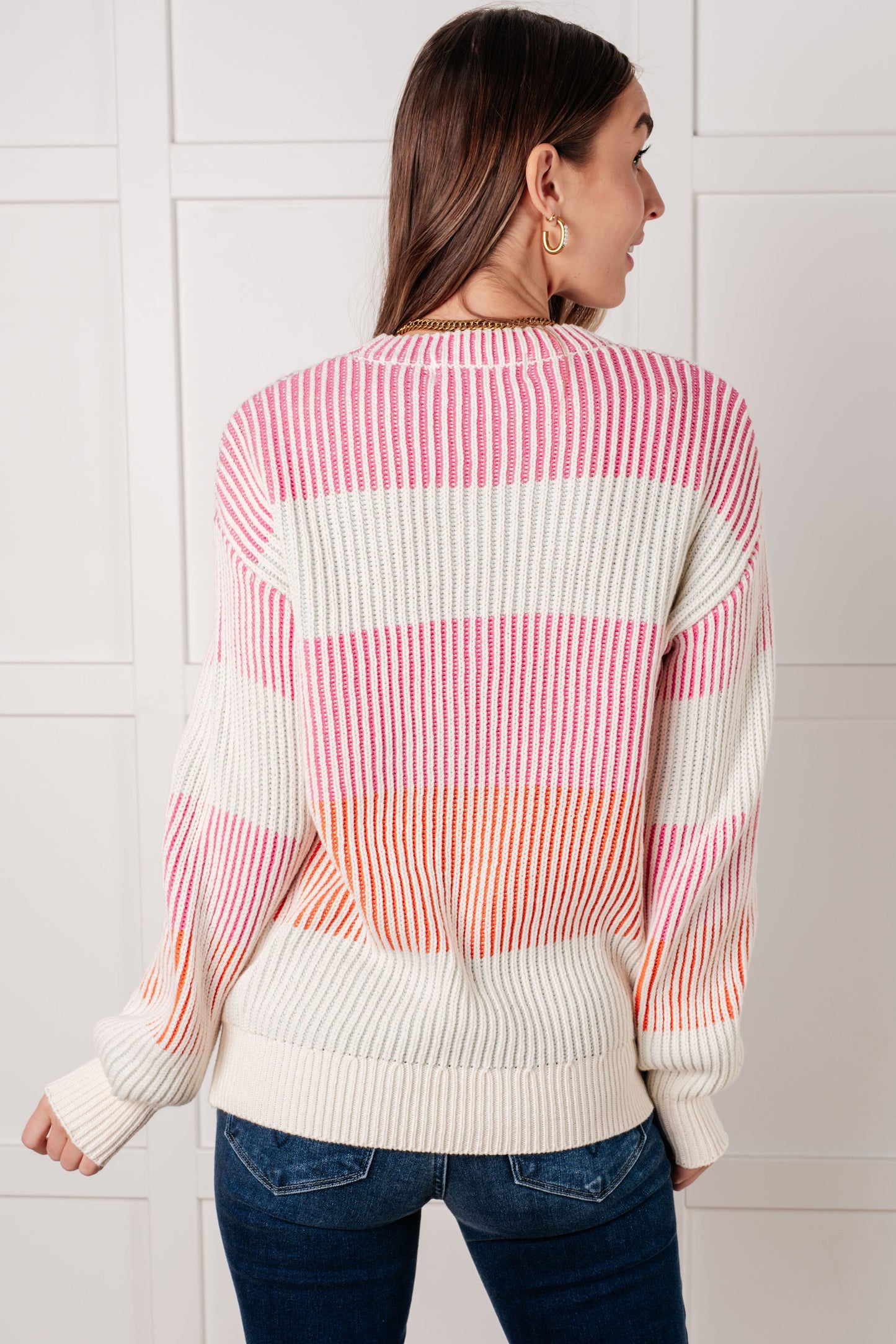 Back of Edie Striped Ribbed Sweater, cream base with pink and orange stripe details