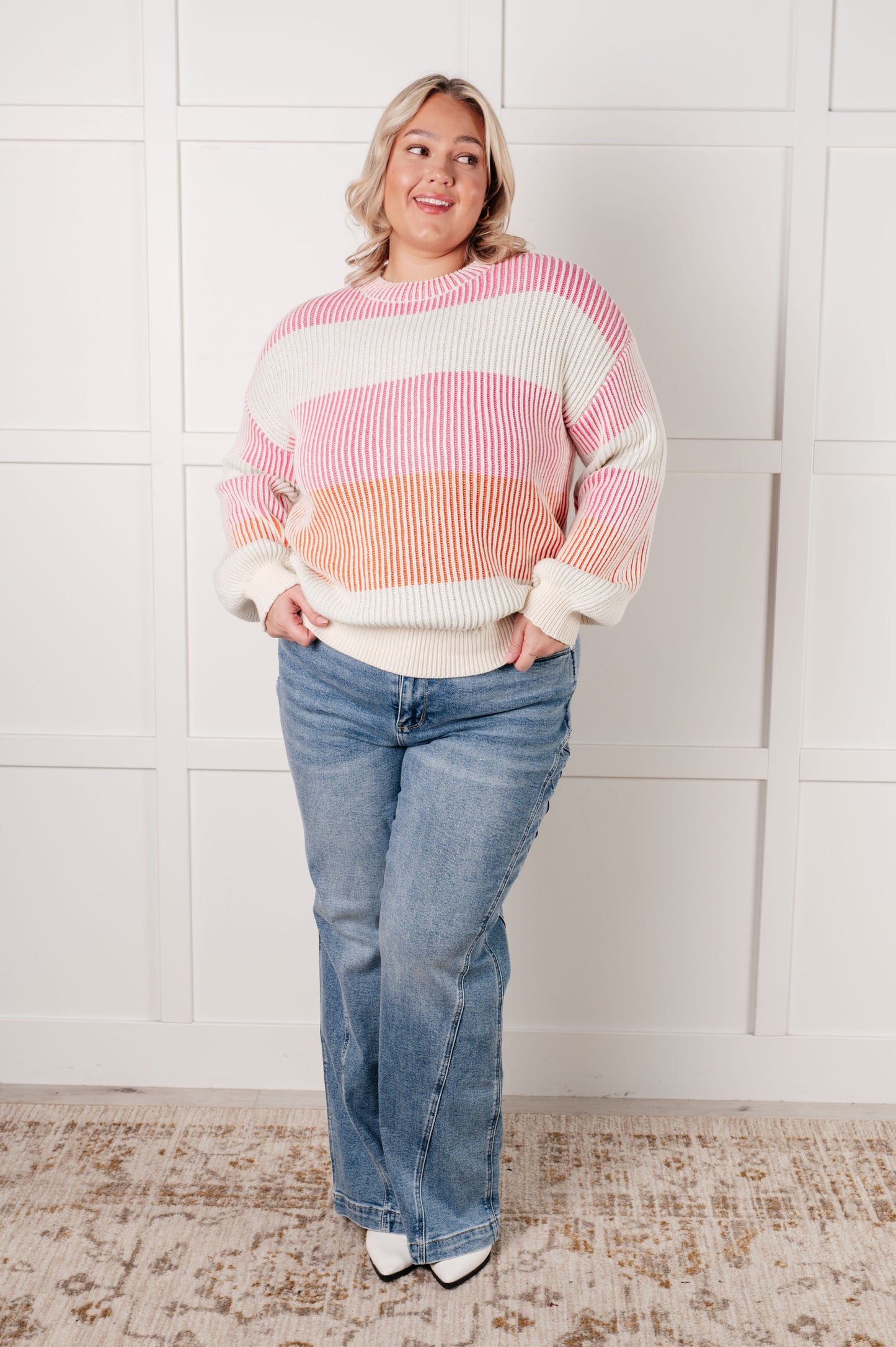 Plus size model full body in Edie Striped Ribbed Sweater, cozy striped knit with round neckline