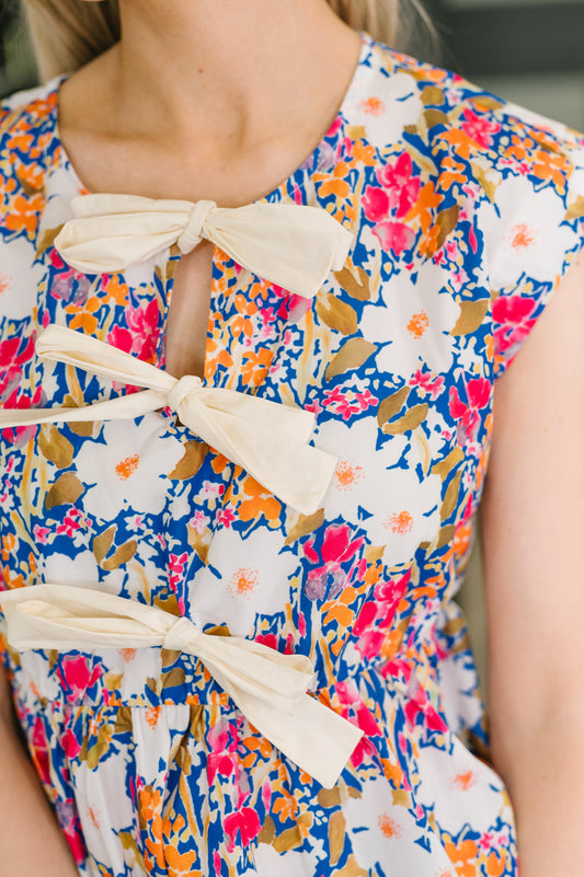 Close up of Missy Bow Detail Peplum Top bow neckline and floral print detail.