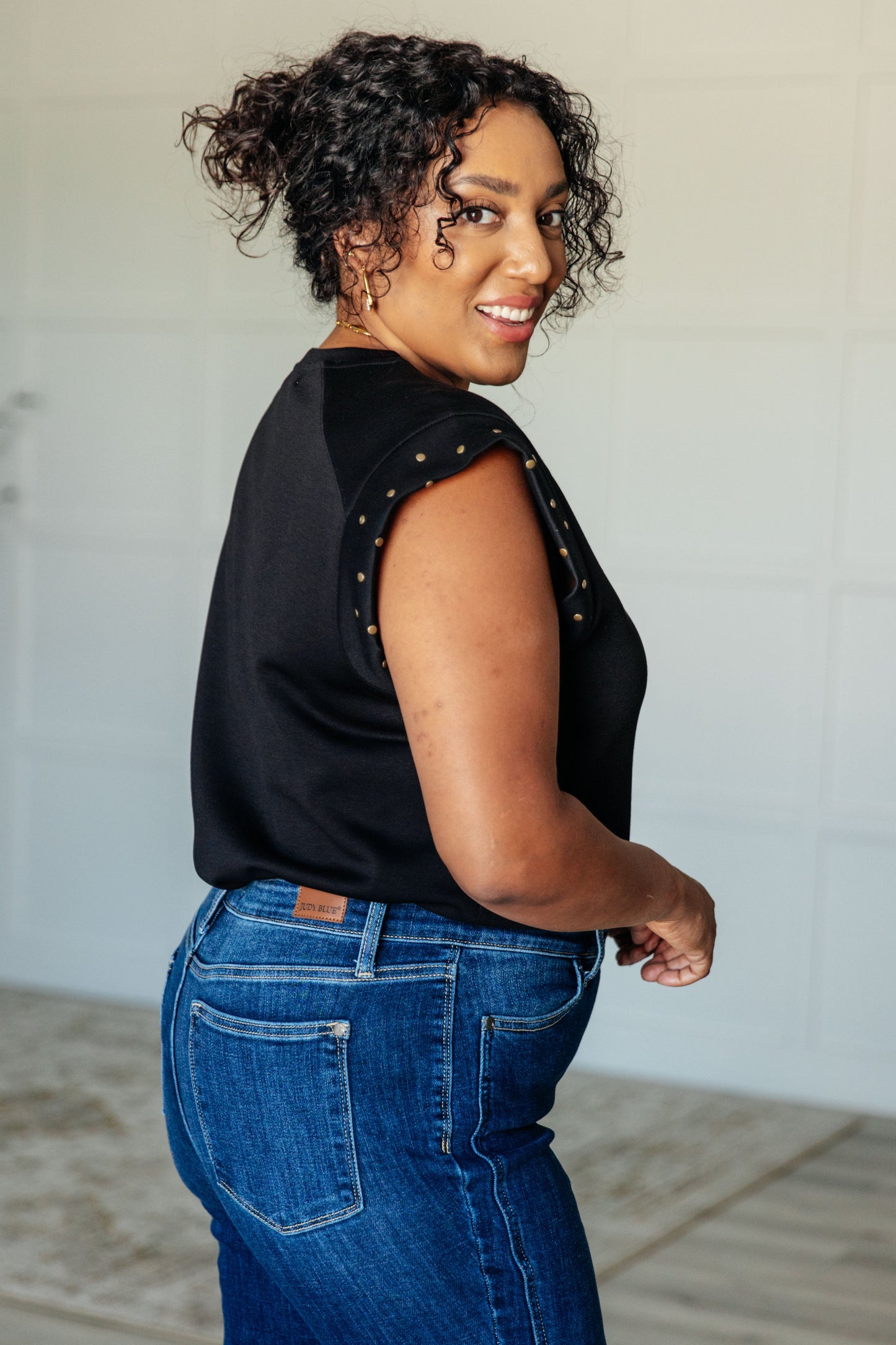 Side angle plus size view of Myla Curvy Plus Studded Cap Sleeve Top showing stud embellishments.