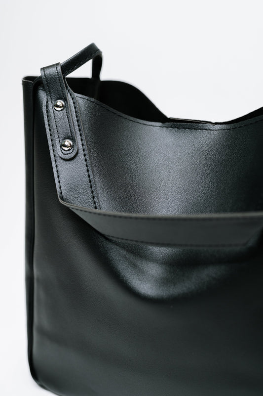 Close-up of My Whole Life Shoulder Bag in Black featuring silver hardware detail.