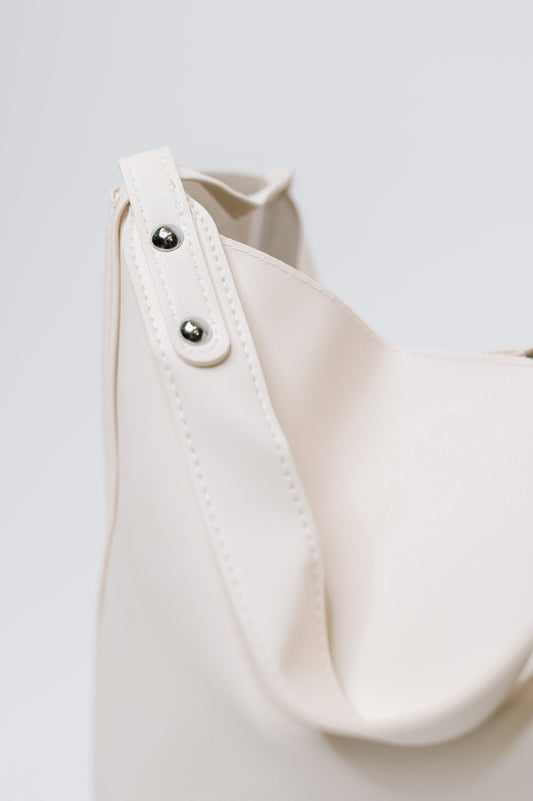 Detail view of My Whole Life Shoulder Bag in Neutral showing stitching and hardware accents.