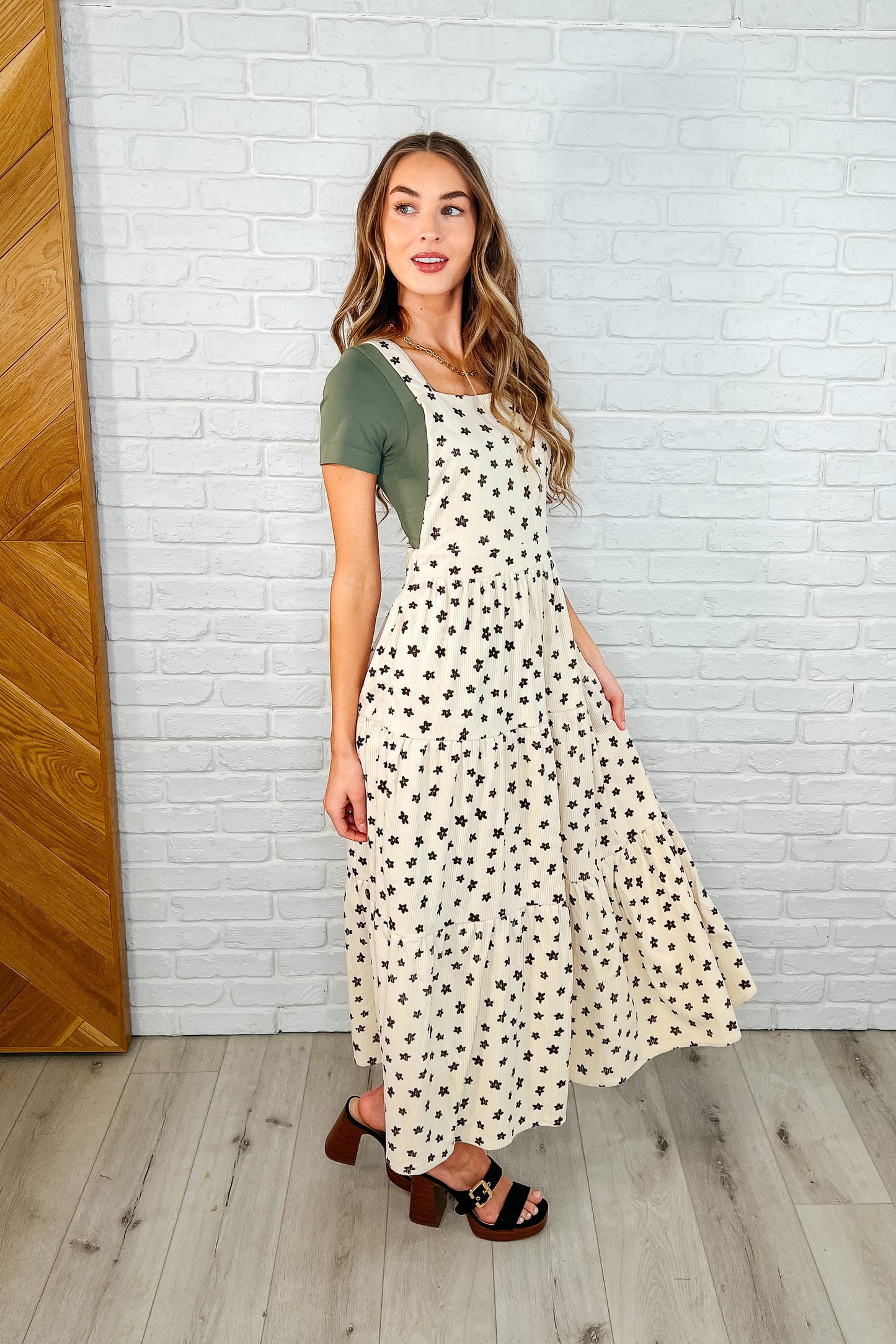 Side profile of Nat Flower Dress with tiered skirt and functional pockets.