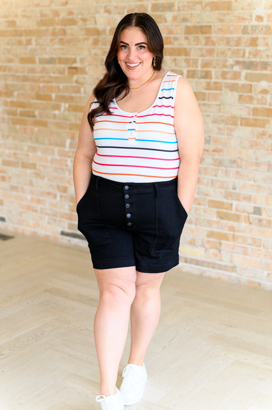 Lightweight plus size sleeveless tank with vibrant stripes and functional buttons – Fae Henley top for warm days.