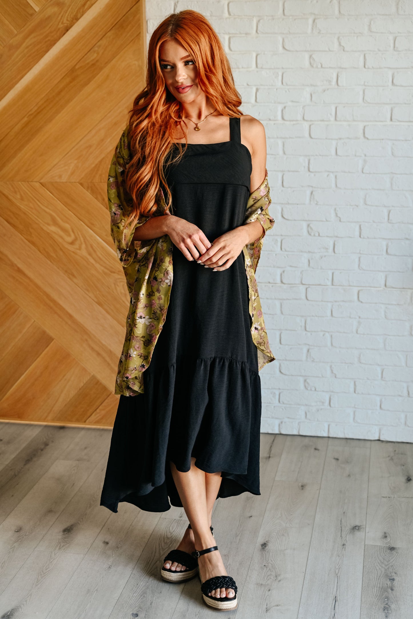 Full front view of Nisha Maxi Dress, highlighting crinkle fabric, side pockets, and flowing high-low silhouette.