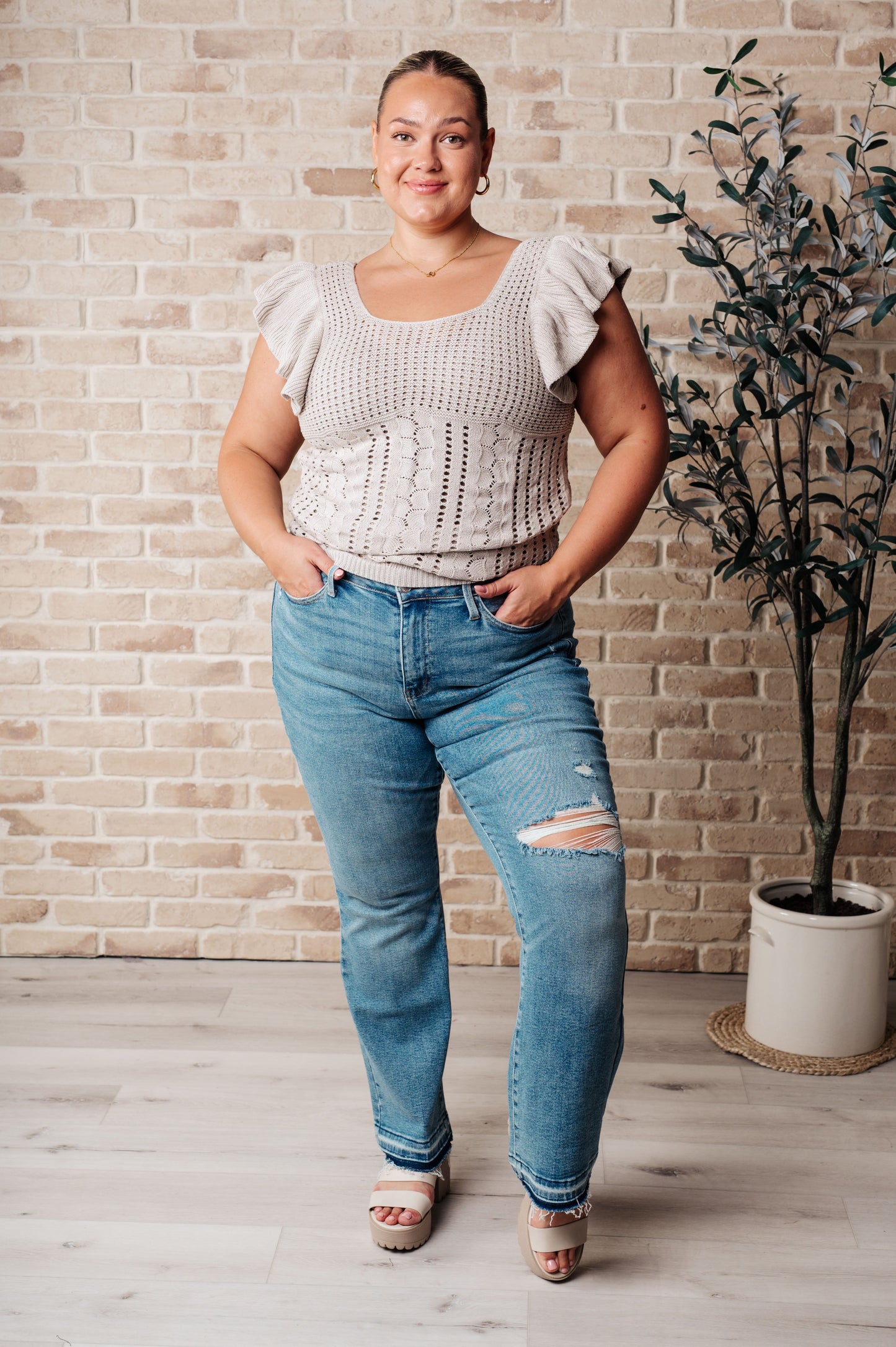 Plus size outfit styled with greige pointelle knit top, flutter sleeves, and square neckline.