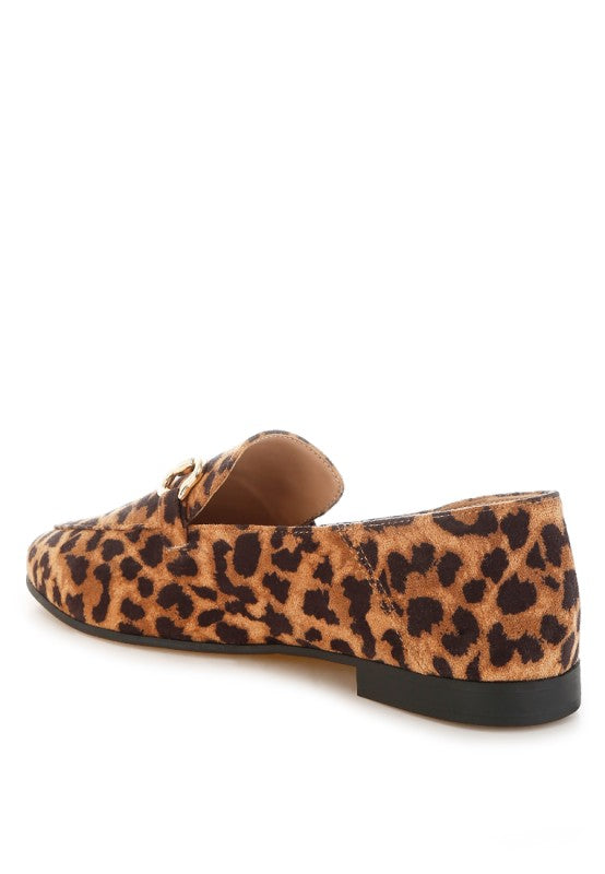 Back view of microfiber leopard loafers with flat heel and rubber sole.