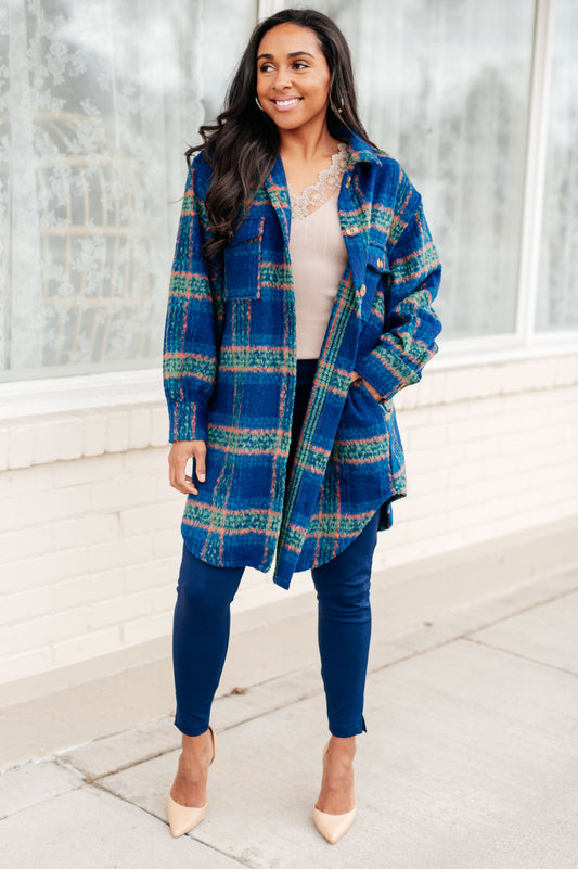 Woman wearing Nona Plaid Coat in blue with collared neckline and button front closure.