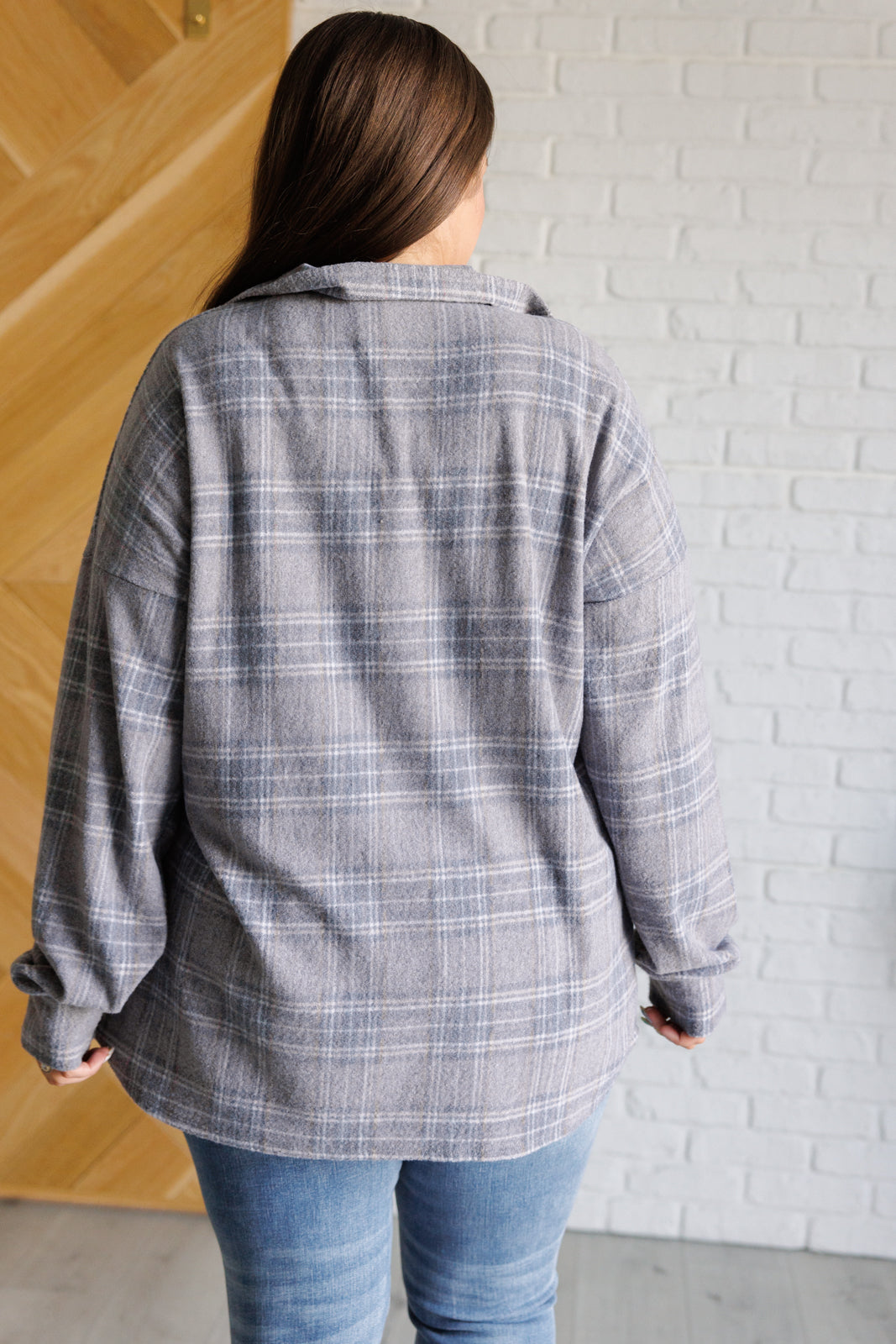Plus size model back view of Harvey Plaid Button Up showing cozy brushed hacci fabric.