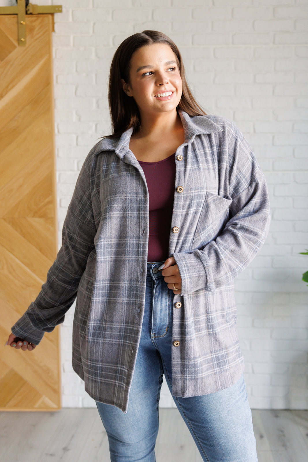 Plus size Harvey Plaid Button Up in light gray plaid with rustic wooden button details.