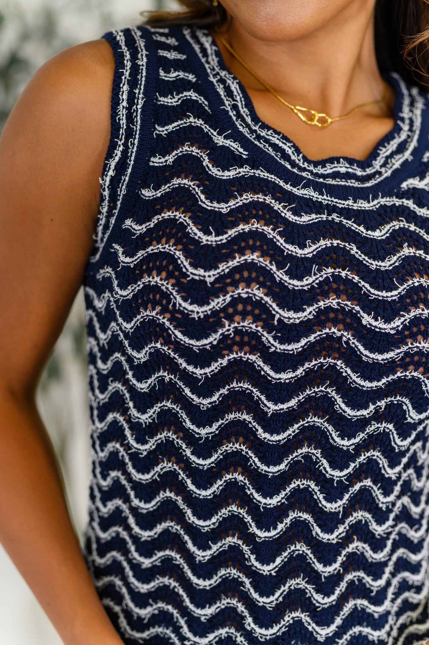 Close-up of the Alena Navy Striped Tank Top highlighting the wavy stripe pattern, open knit texture, and scalloped neckline.
