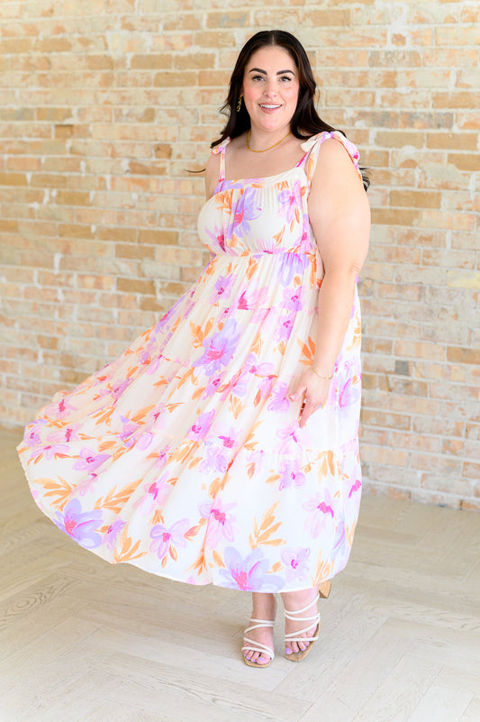 Plus size, sleeveless Pia Midi Dress in pastel floral print featuring a square neckline, elastic waistband, and lightweight tiered skirt with full lining.