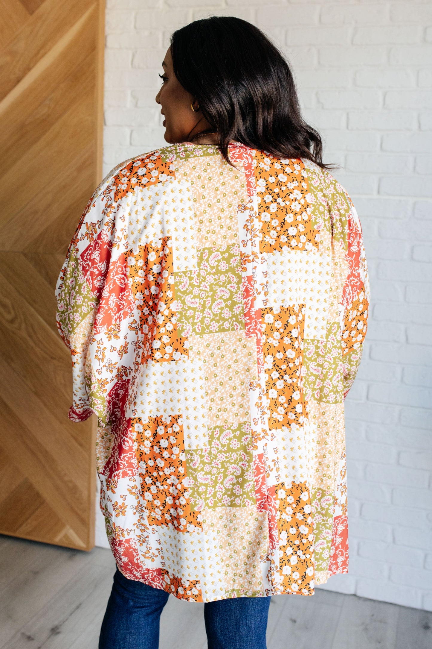 Plus size back view of kimono featuring vibrant mixed floral print on breezy poplin.