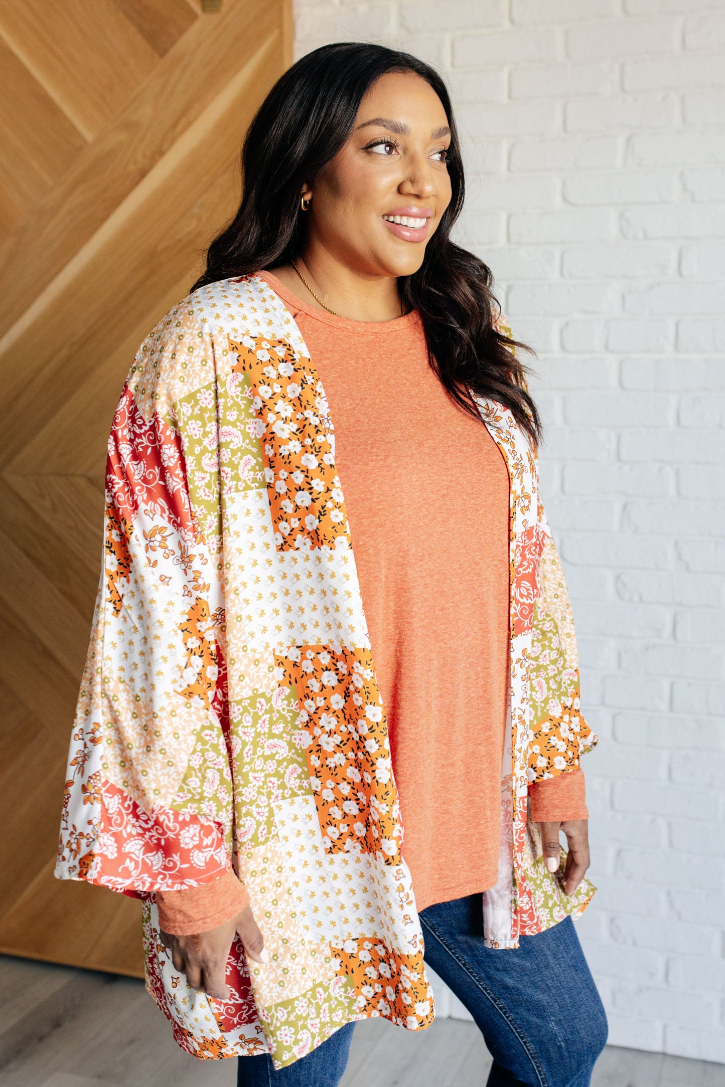 Plus size side view of kimono highlighting floral mix, dolman sleeves, and breezy fit.