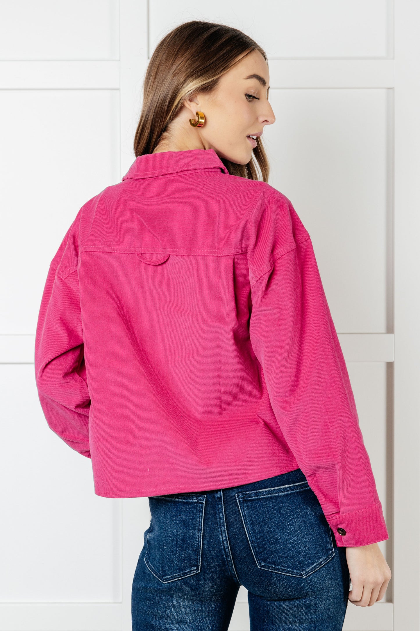 Back view of Poppy Pink Jacket in pink corduroy showing relaxed silhouette.