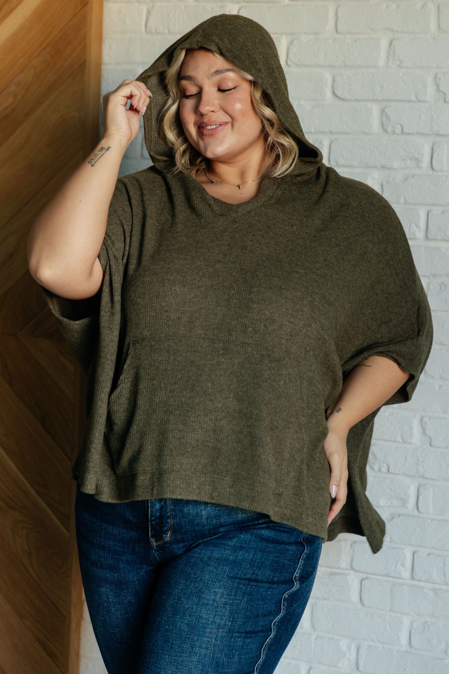 Plus size model front view of Salma Hooded Poncho in Olive