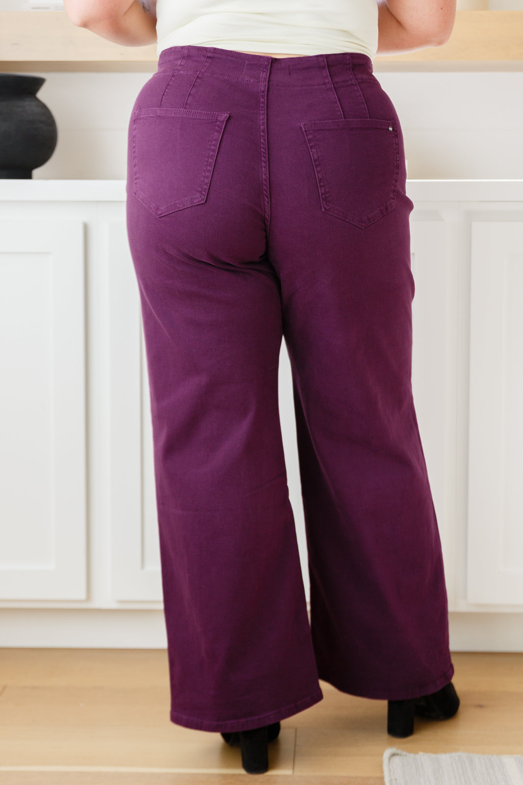 Plus size back view of Petunia Jeans in plum showing wide-leg fit and flattering back rise.