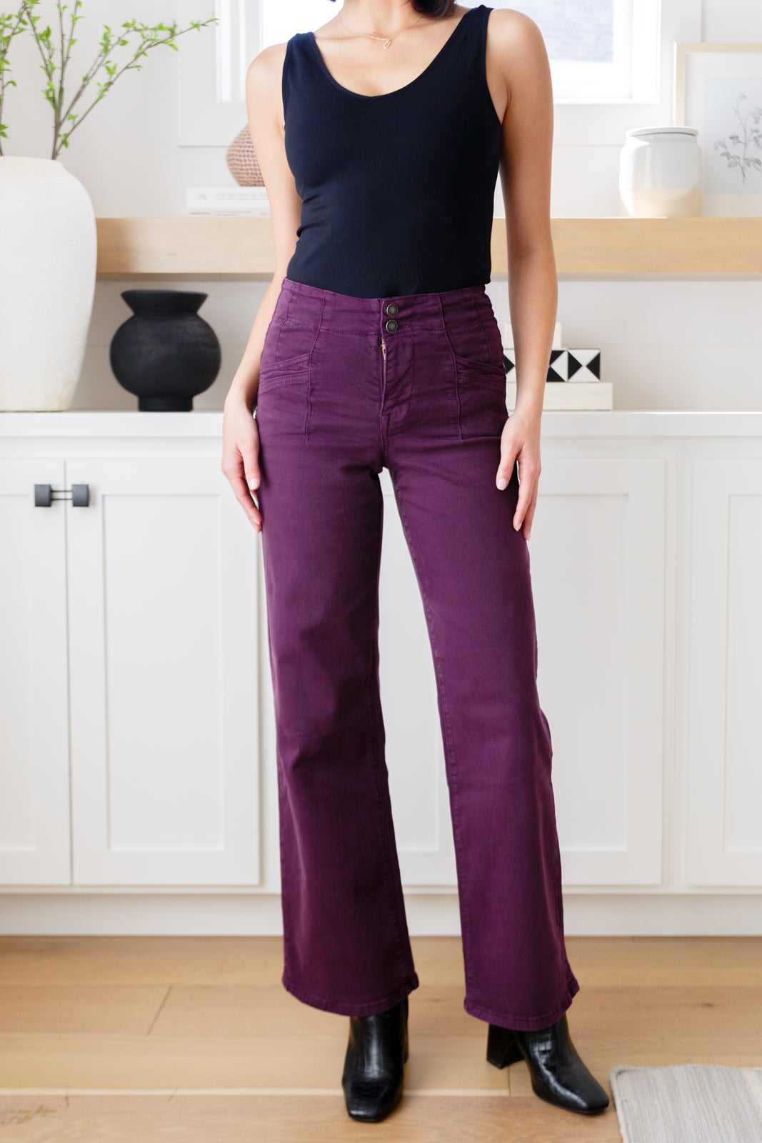 Front view of Petunia High Rise Wide Leg Jeans in plum with tailored waistband and wide-leg silhouette.