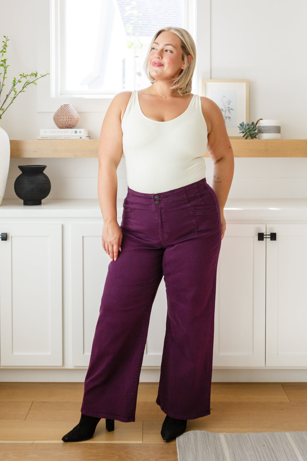 Plus size full body view of Petunia Jeans in plum wide-leg silhouette with chic tailored fit.