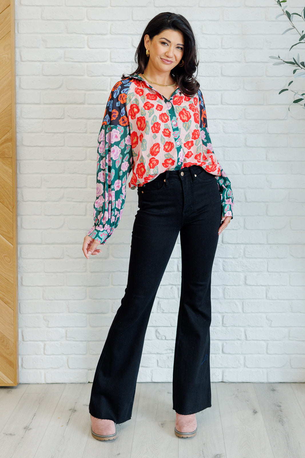 Full body view of Gisselle Mixed Print Blouse paired with pants showing round hemline and balloon sleeves.