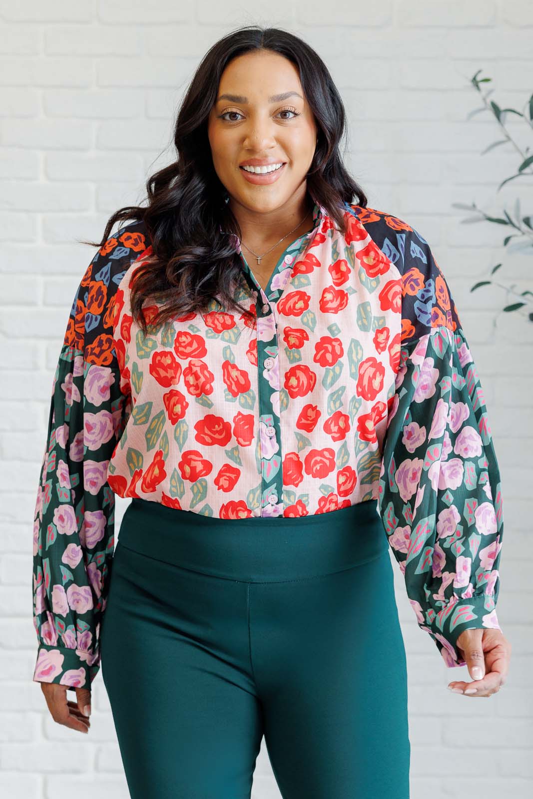 Plus size front view of Gisselle Mixed Print Blouse showing high neckline, ruffle detail, and balloon sleeves.